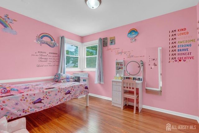 186 Tyler Ave, Iselin, NJ 08830 - bedroom with wood finished floors and baseboards