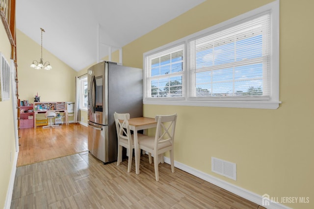 186 Tyler Ave, Iselin, NJ 08830 - dining space with a chandelier, light wood-style flooring, and vaulted ceiling