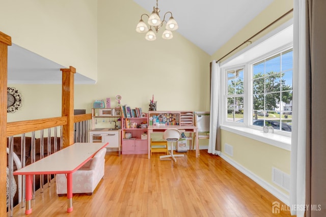 186 Tyler Ave, Iselin, NJ 08830 - rec room with lofted ceiling, a chandelier, and wood finished floors