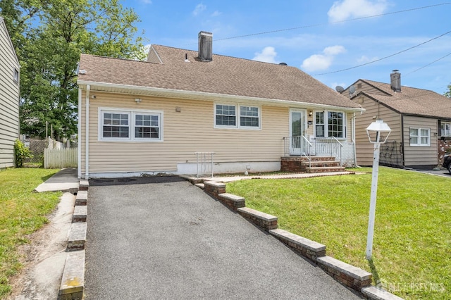 186 Tyler Ave, Iselin, NJ 08830 - view of front of home featuring a chimney and a shingled roof