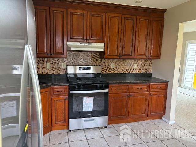 21 Rice Run, East Brunswick, NJ 08816 - kitchen featuring appliances with stainless steel finishes, under cabinet range hood, decorative backsplash, brown cabinetry, and light tile patterned floors