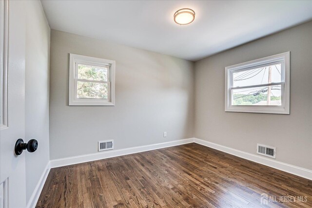 15 Crassas St, Old Bridge, NJ 08879 - unfurnished room with plenty of natural light and dark wood finished floors