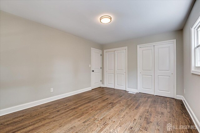 15 Crassas St, Old Bridge, NJ 08879 - unfurnished bedroom with multiple closets and wood finished floors