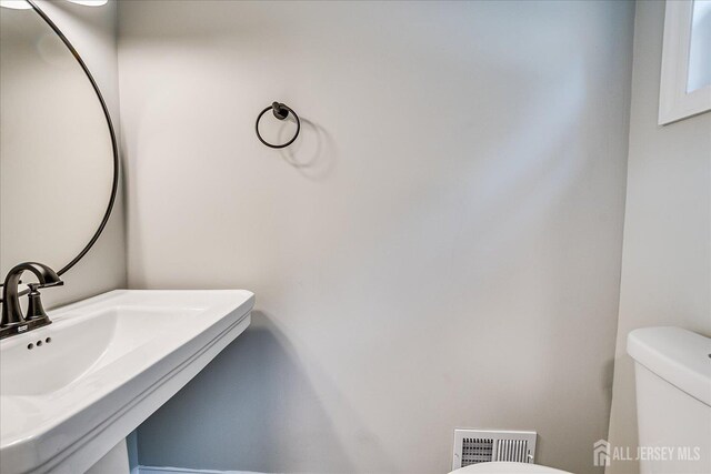 15 Crassas St, Old Bridge, NJ 08879 - bathroom featuring toilet and a sink