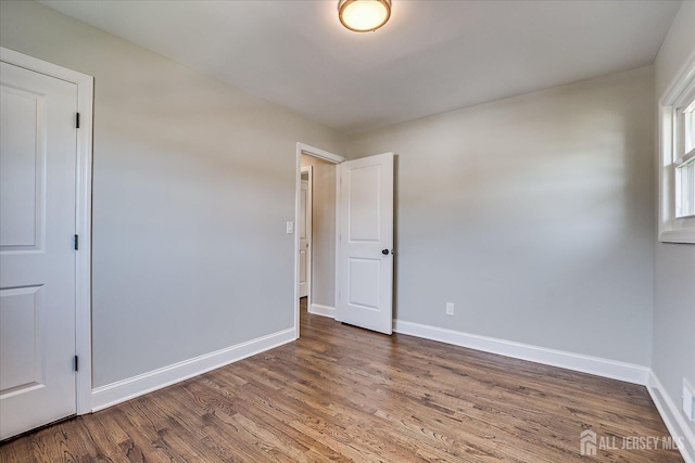 15 Crassas St, Old Bridge, NJ 08879 - unfurnished room with wood finished floors and baseboards