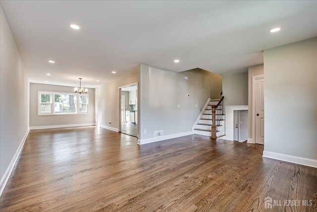 15 Crassas St, Old Bridge, NJ 08879 - unfurnished room featuring stairway, a chandelier, wood finished floors, and recessed lighting