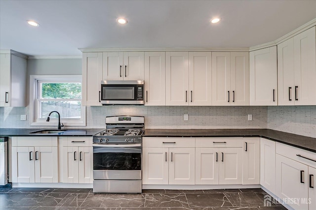 15 Crassas St, Old Bridge, NJ 08879 - kitchen with stainless steel appliances, dark marble finish floors, crown molding, dark countertops, and recessed lighting