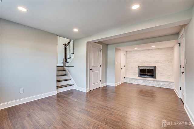 15 Crassas St, Old Bridge, NJ 08879 - unfurnished living room with wood finished floors, stairway, a fireplace, and recessed lighting