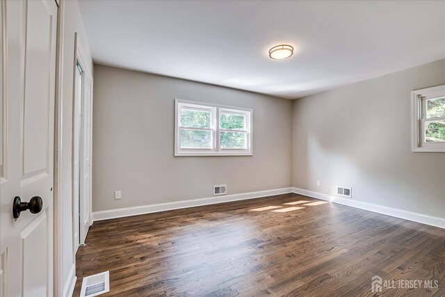15 Crassas St, Old Bridge, NJ 08879 - unfurnished bedroom featuring dark wood-style floors and baseboards