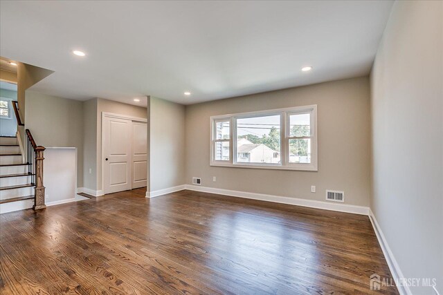 15 Crassas St, Old Bridge, NJ 08879 - unfurnished room with stairs, dark wood-type flooring, and recessed lighting