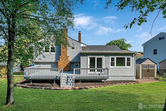 15 Crassas St, Old Bridge, NJ 08879 - rear view of property with a storage unit, a chimney, a wooden deck, and a yard
