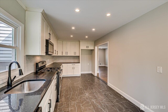 15 Crassas St, Old Bridge, NJ 08879 - kitchen with appliances with stainless steel finishes, dark marble finish flooring, recessed lighting, tasteful backsplash, and dark stone countertops