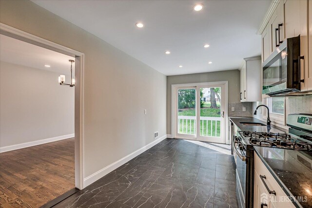 15 Crassas St, Old Bridge, NJ 08879 - kitchen featuring appliances with stainless steel finishes, recessed lighting, dark stone counters, backsplash, and a chandelier