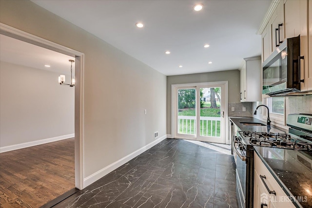 15 Crassas St, Old Bridge, NJ 08879 - kitchen with appliances with stainless steel finishes, recessed lighting, dark stone counters, tasteful backsplash, and a chandelier
