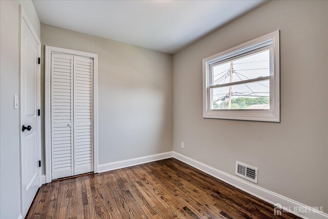 15 Crassas St, Old Bridge, NJ 08879 - unfurnished bedroom featuring dark wood finished floors and a closet