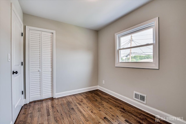 15 Crassas St, Old Bridge, NJ 08879 - unfurnished bedroom with dark wood-style flooring and a closet