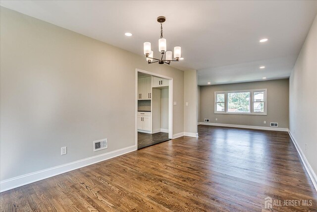 15 Crassas St, Old Bridge, NJ 08879 - spare room featuring a chandelier, dark wood-style flooring, and recessed lighting