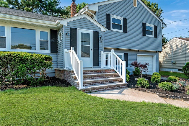 15 Crassas St, Old Bridge, NJ 08879 - view of front of house with a chimney, a front yard, and an attached garage