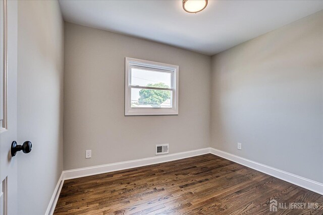 15 Crassas St, Old Bridge, NJ 08879 - spare room with dark wood-type flooring