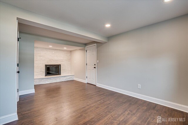 15 Crassas St, Old Bridge, NJ 08879 - unfurnished living room featuring dark wood finished floors, recessed lighting, and a stone fireplace