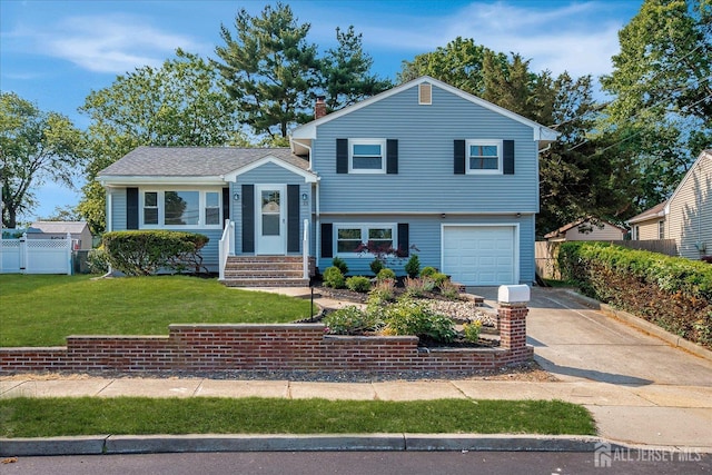 15 Crassas St, Old Bridge, NJ 08879 - split level home with concrete driveway, an attached garage, entry steps, and a chimney