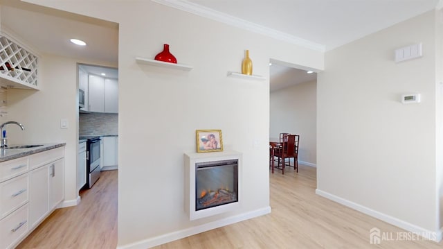 414-D Andover Dr, Monroe, NJ 08831 - corridor featuring a sink, light wood-type flooring, crown molding, baseboards, and recessed lighting
