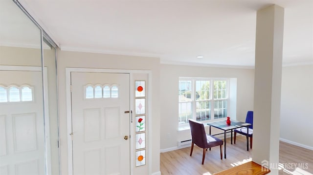 414-D Andover Dr, Monroe, NJ 08831 - entryway featuring crown molding, light wood-style floors, baseboards, and a baseboard heating unit
