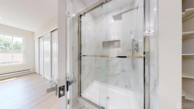 414-D Andover Dr, Monroe, NJ 08831 - bathroom with a marble finish shower, wood finished floors, and a baseboard heating unit