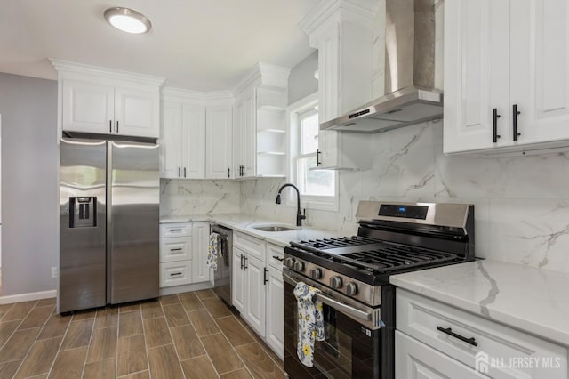 kitchen with a sink, open shelves, wall chimney exhaust hood, white cabinets, and appliances with stainless steel finishes
