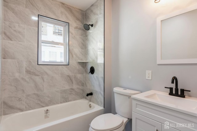 full bathroom featuring bathing tub / shower combination, toilet, and vanity