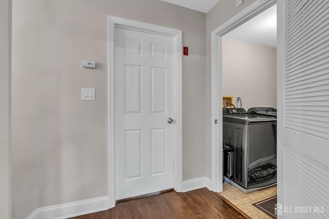 103 Rumford Way, Manalapan, NJ 07726 - laundry area featuring dark wood finished floors, baseboards, and separate washer and dryer