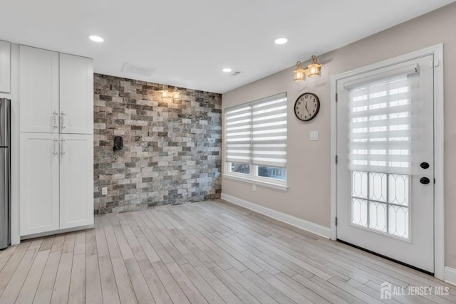 103 Rumford Way, Manalapan, NJ 07726 - unfurnished dining area featuring light wood finished floors, baseboards, and recessed lighting