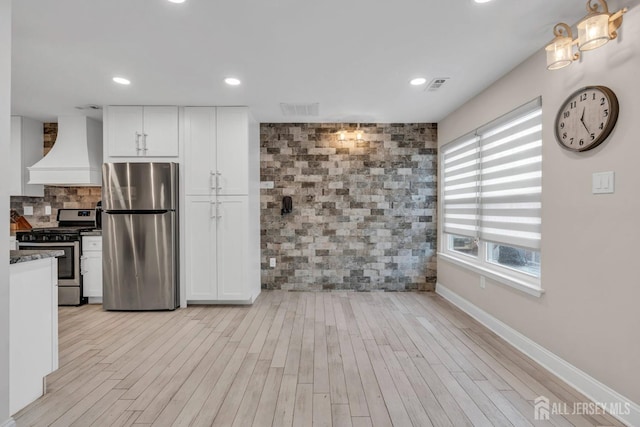 103 Rumford Way, Manalapan, NJ 07726 - kitchen featuring appliances with stainless steel finishes, custom exhaust hood, white cabinetry, light wood finished floors, and recessed lighting