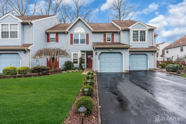 103 Rumford Way, Manalapan, NJ 07726 - multi unit property with asphalt driveway, an attached garage, and a front lawn