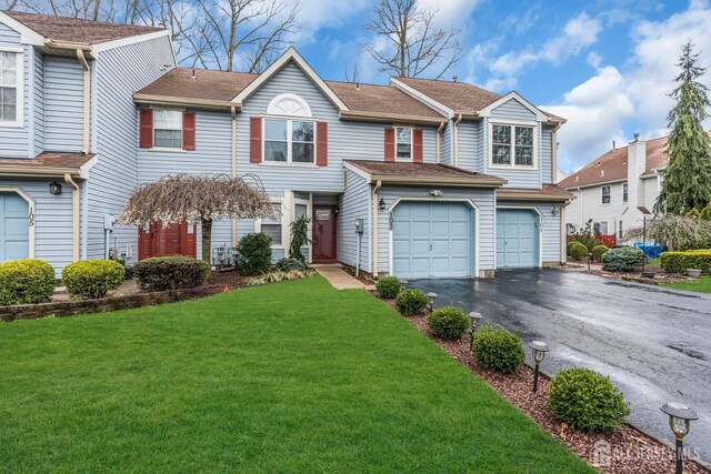 103 Rumford Way, Manalapan, NJ 07726 - view of front facade featuring asphalt driveway and a front yard