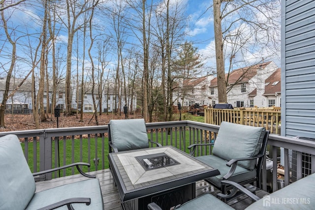 103 Rumford Way, Manalapan, NJ 07726 - wooden terrace featuring a fire pit, a lawn, and a residential view
