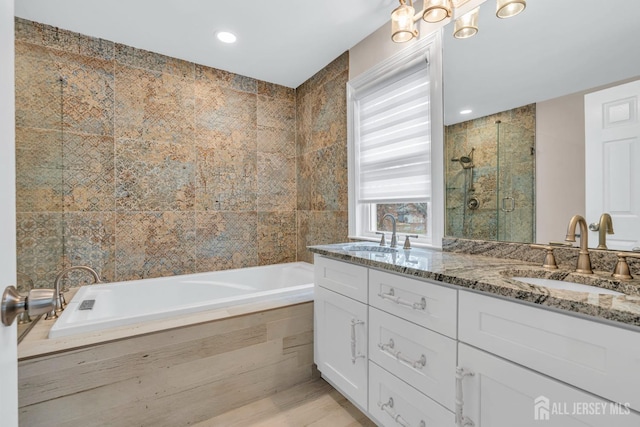 103 Rumford Way, Manalapan, NJ 07726 - bathroom featuring a shower stall, a bath, double vanity, and recessed lighting