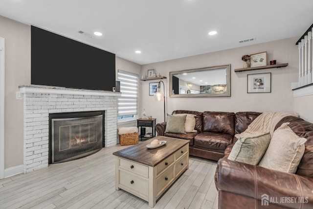 103 Rumford Way, Manalapan, NJ 07726 - living area featuring light wood finished floors, a fireplace, and recessed lighting