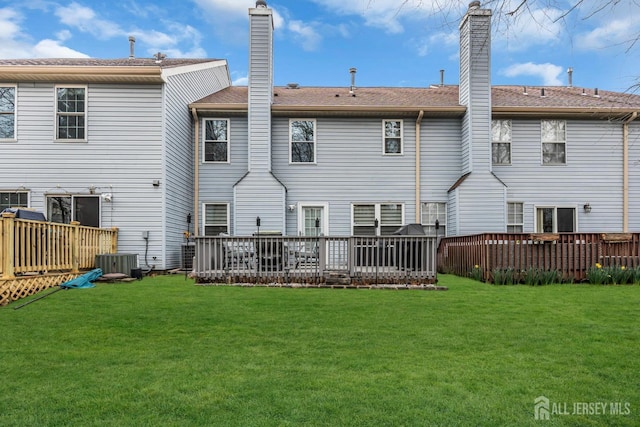 103 Rumford Way, Manalapan, NJ 07726 - back of property featuring a yard, a wooden deck, and a chimney