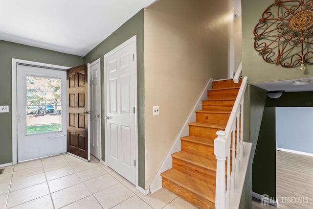 entryway featuring light tile patterned flooring