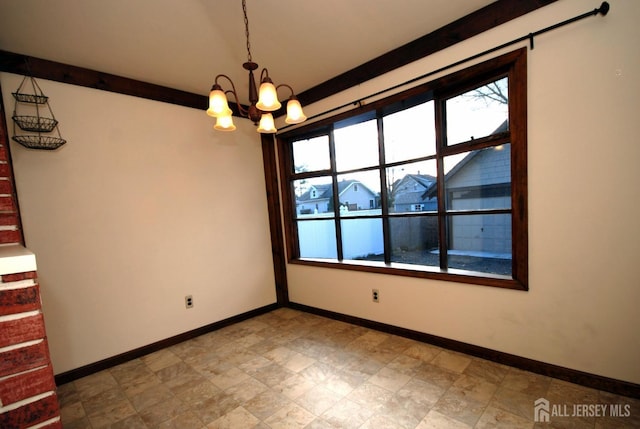 unfurnished dining area featuring an inviting chandelier