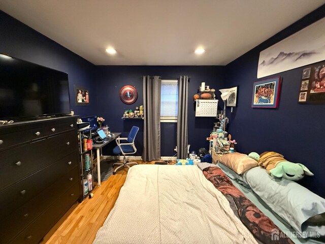 bedroom with light hardwood / wood-style floors