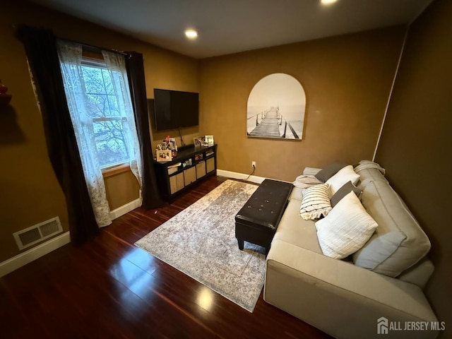 living room with dark hardwood / wood-style floors