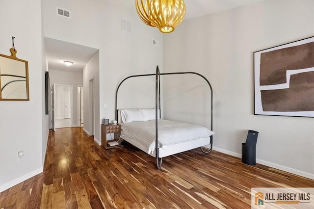 6503 Schindler Dr, South Brunswick, NJ 08852 - bedroom with wood finished floors and a chandelier