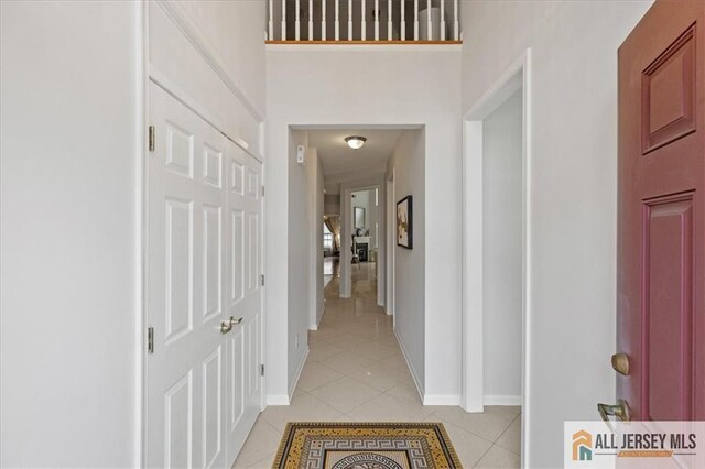 6503 Schindler Dr, South Brunswick, NJ 08852 - corridor featuring light tile patterned floors and baseboards