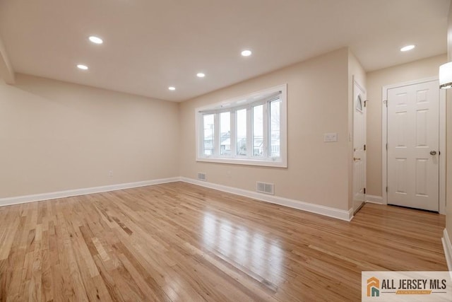 interior space featuring light wood-style floors, baseboards, visible vents, and recessed lighting