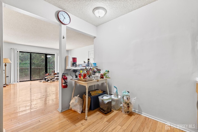 255 Hampshire Ct, Piscataway, NJ 08854 - hallway featuring a textured ceiling and wood-type flooring