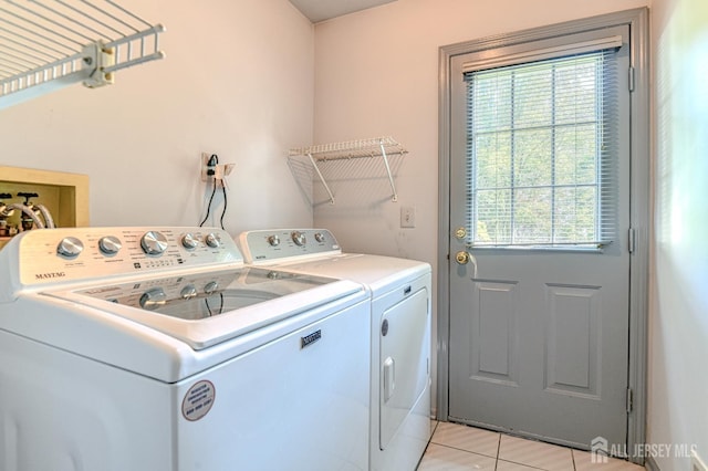 38 Silver Holw, North Brunswick, NJ 08902 - laundry area featuring separate washer and dryer, plenty of natural light, and light tile patterned floors