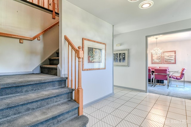 38 Silver Holw, North Brunswick, NJ 08902 - staircase featuring a chandelier, baseboards, and tile patterned floors
