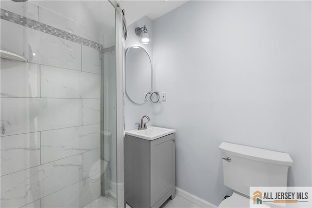 full bath featuring marble finish floor, toilet, a stall shower, vanity, and baseboards